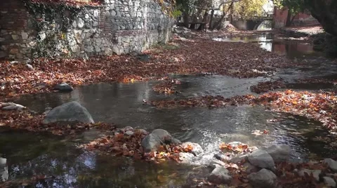 A river flows over rocks in this beautiful scene . Autumn. Stock Footage 44642594