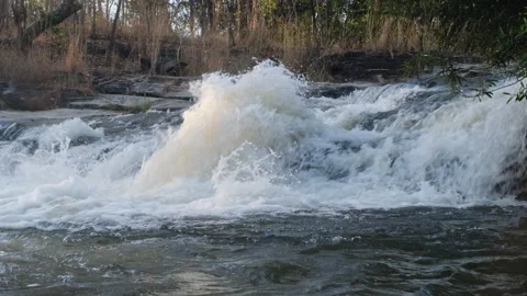River flows over rocks in the deep forest on mountain. Waterfall Stock Footage 171211874