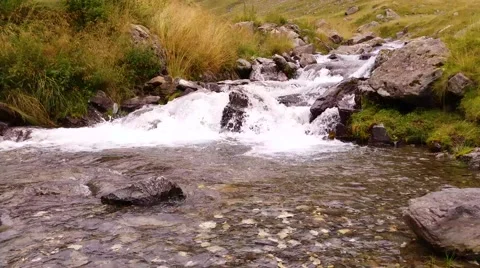 A river flows over rocks Stock Footage 41514840
