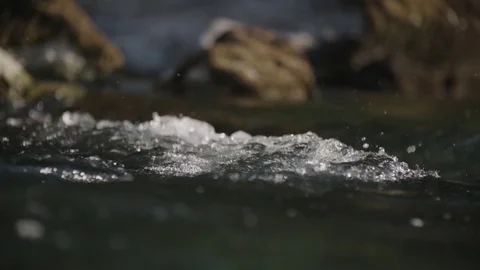 River flows over rocks Stockbeeldmateriaal 76554944