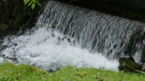 A river flows over a waterfall Stock Footage 126718381