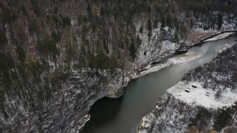 The river flows in a semicircle through the winter forest Video stock 148502263