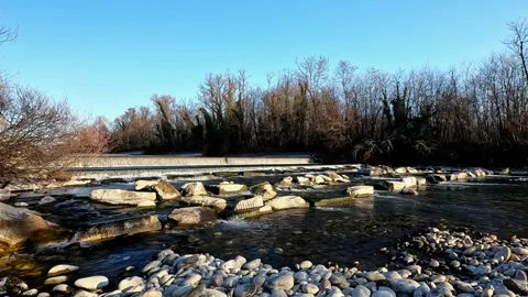The River Flows Slowly Between the Rocks Stockbeeldmateriaal 337075987