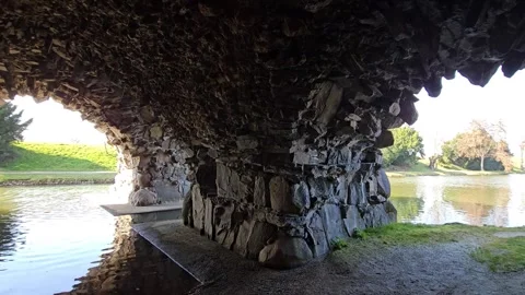 The river flows in a stone grotto Stock Footage 304913721