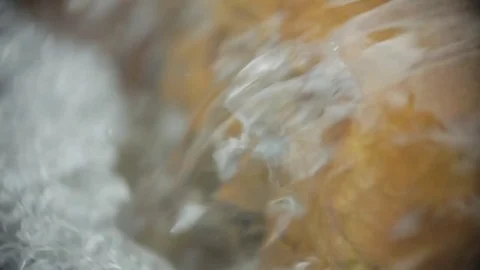 River flows onto stream bed, slo-mo. Stock Footage 82328345