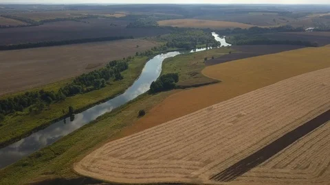 River flows through beautiful colorful fields. Aerial view. Stock-Footage 117423031