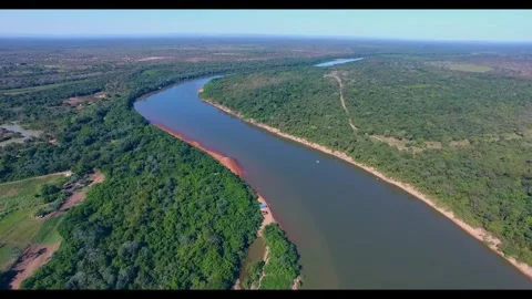 A river flows through beautiful surroundings and nature. Stock Footage 318465367