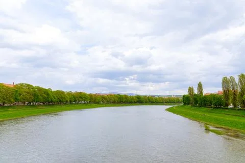 The river flows through the city, dividing the city into two parts. Stock Photos