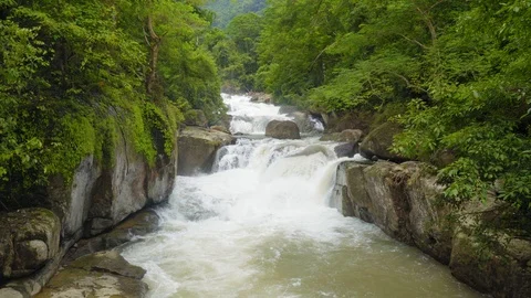 The river flows through the forest. Nangrong Waterfall Thailand. 4K Stock Footage 94760841