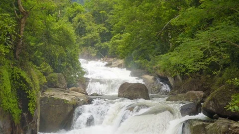 The river flows through the forest. Nangrong Waterfall Thailand. 4K Video stock 94761969