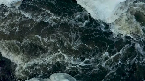 River flows through the ice and snow of winter. Clear water, stones on bottom 스톡 동영상 165347147