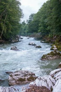 The river flows through a mountainous area in a forest in the Austrian Alps Stock Photos