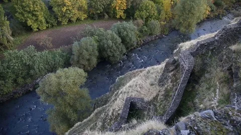 The river flows through the rocks in this beautiful place in the mountains in Stock Footage 82795514