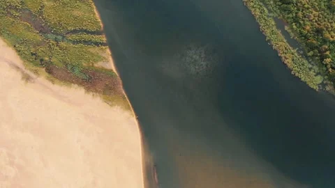 A river flows through a sandy landscape Stock-Footage 312482516