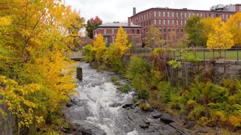 River flows through town in autumn Stock Footage 312537443