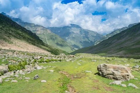 A river flows through a valley with mountainous surroundings, Kashmir, India Stock Photos