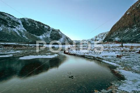 A river flows toward a fjord in norway Stock Photos