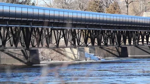 River flows under bridge Stock Footage 59697799