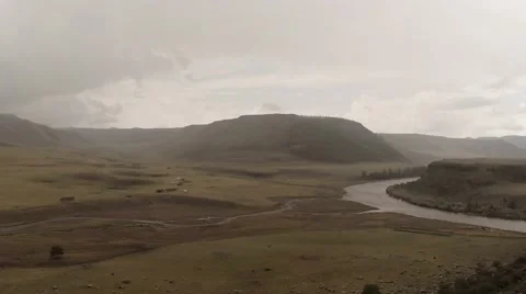 River flows under the cloudy sky in the mountains of Mongolia Stock Footage 57400977