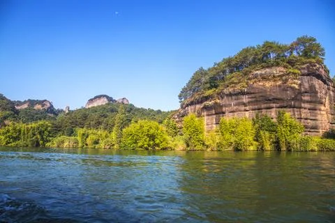 A river flows under a Karst mountain scenery Fotos de archivo