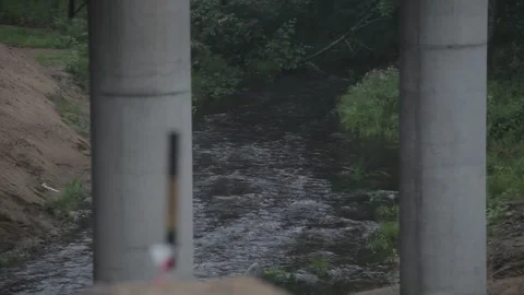 The river flows, video from the bridge, it rains Stock Footage 276968222