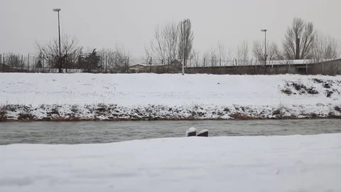 River Flows Winter Warehouse Lights City Landscape Snow Video stock 71254420