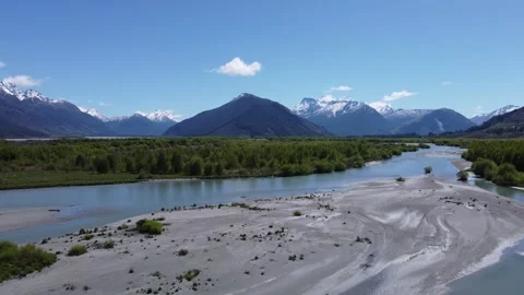 River Fly Over Towards Central Mountain Peak 4K Stock Footage 257393353