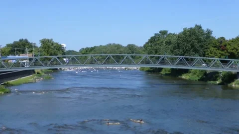 River with Footbridge 4K Stock Footage 137213971