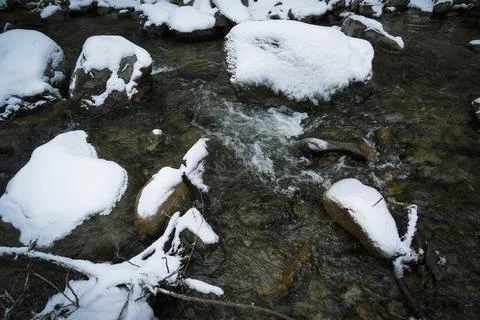 River in forested mountains in winter Stock Photos