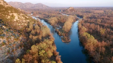 River fork on a blue stream of water in autumn Stock Footage 127259362
