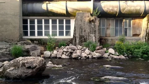 River front of an old iron foundry house Stock Footage 157370295