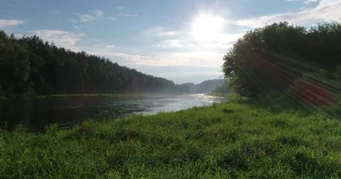 River in front of a sun Stock Footage 95066397