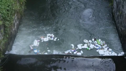 The river is full of plastic waste Stock Footage 272747804