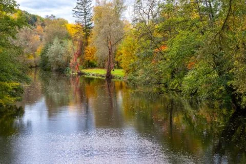 River Glan surrounded with multi colored trees Stock Photos