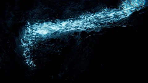 River glows blue in the dark cave Stock Footage 220422213