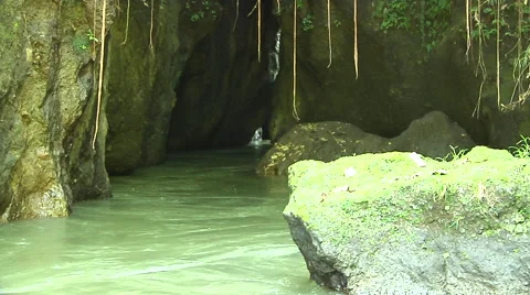 River going under mountain in the jungle in Bali Stock Footage 41379699