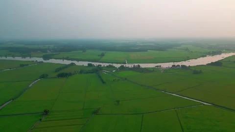 River of Gold A Breathtaking 4K Drone Sunset over a Majestic Landscape and R Stock Footage 241507766