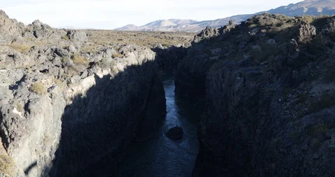 River Grande passing through trails of lava of Payunia Region Stockbeeldmateriaal 91876738