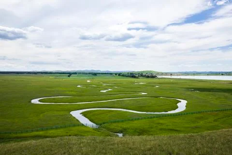 The river on the grassland Stock Photos