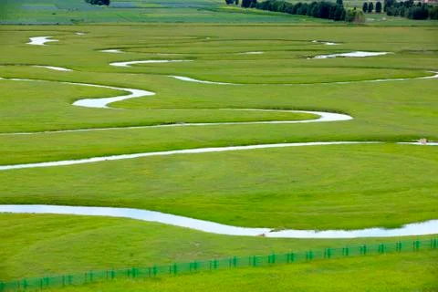 The river on the grassland Stock Photos