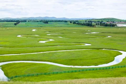 The river on the grassland Stock Photos
