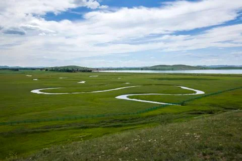 The river on the grassland Stock Photos