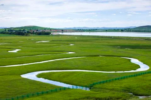 The river on the grassland Stock Photos