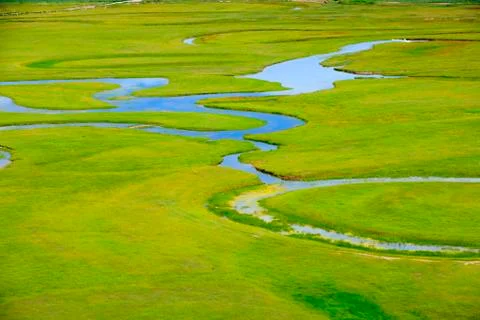 The river on the grassland Stock Photos