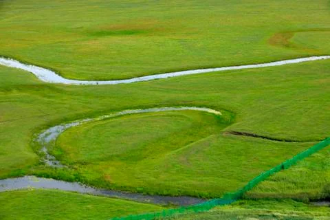The river on the grassland Stock Photos
