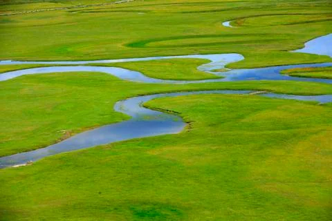 The river on the grassland Stock Photos