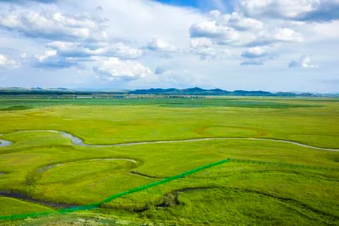 The river on the grassland Stock Photos
