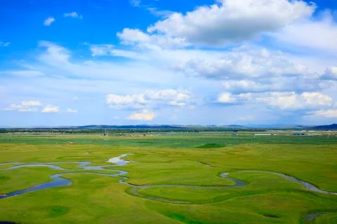 The river on the grassland Stock Photos