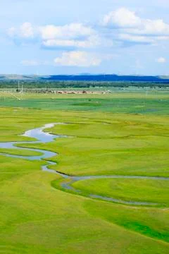 The river on the grassland Stock Photos