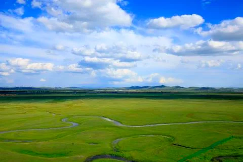 The river on the grassland Stock Photos